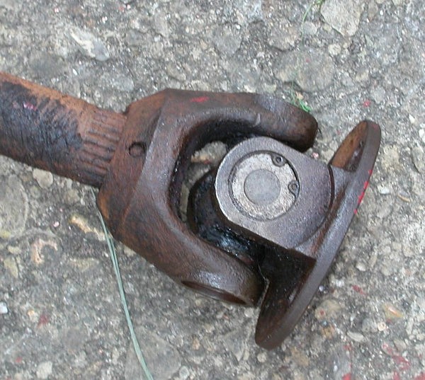 old universal joint on a concrete background